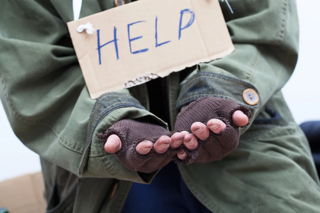 photo of panhandler holding a sign